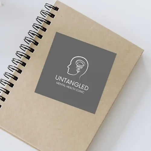 Label on Notebook Mental Health Clinic Logo Mockup